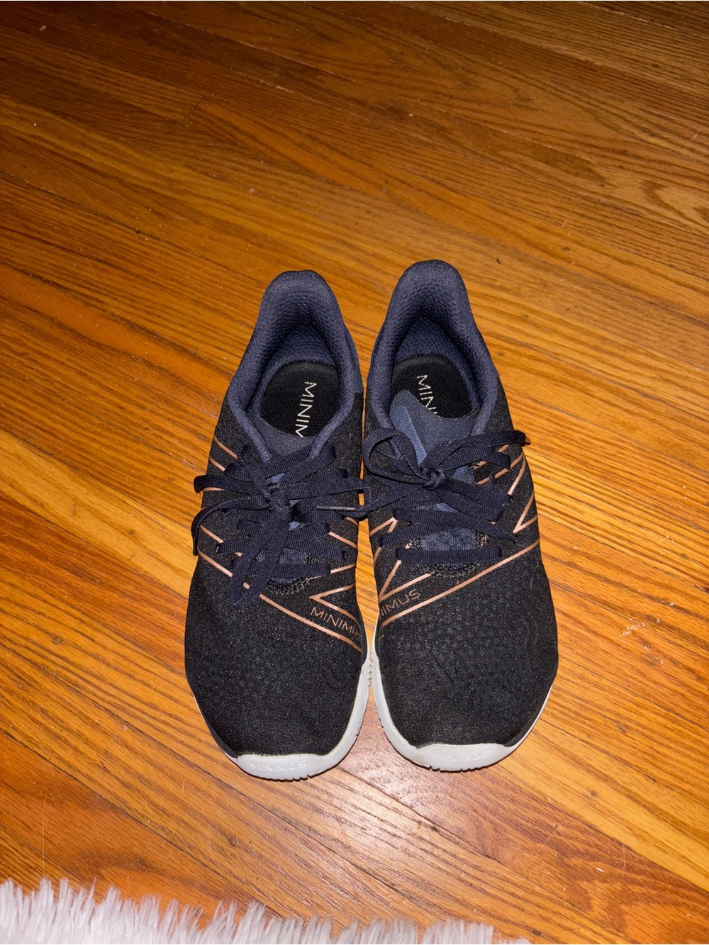 New Balance Women's Black Athletic Sneakers with Tan Accents